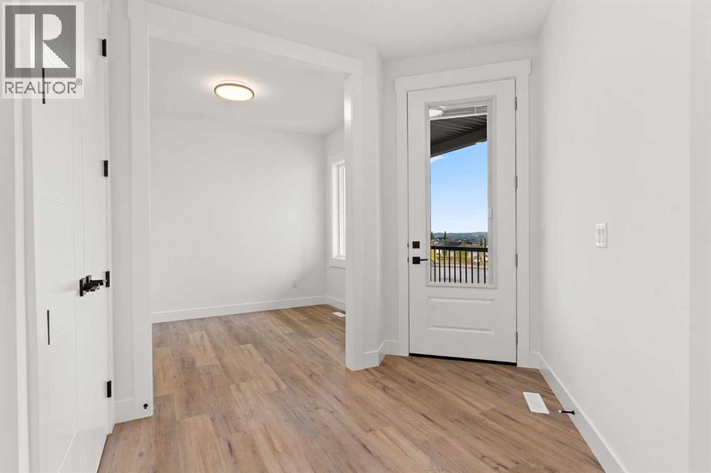 Picture is from a recent build by the builder with similar finishes and will be similar but not an exact match - 53 Heritage Park, Cochrane, AB - Indoor Photo Showing Other Room