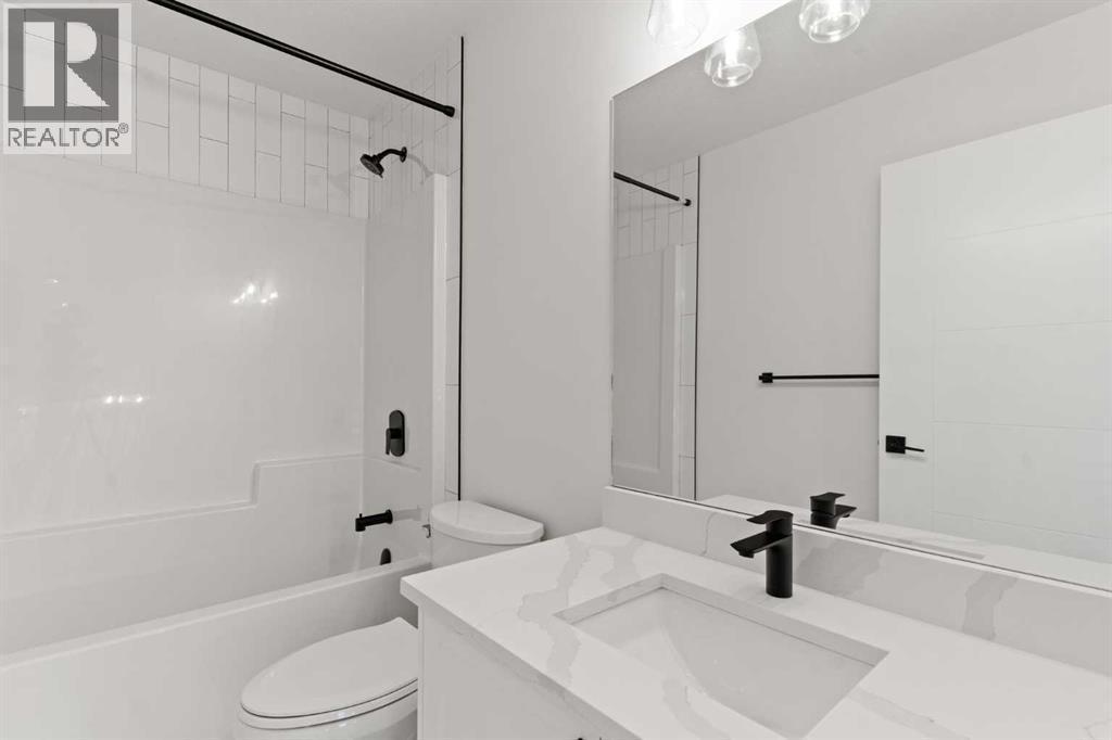 Picture is from a recent build by the builder with similar finishes and will be similar but not an exact match - 53 Heritage Park, Cochrane, AB - Indoor Photo Showing Bathroom