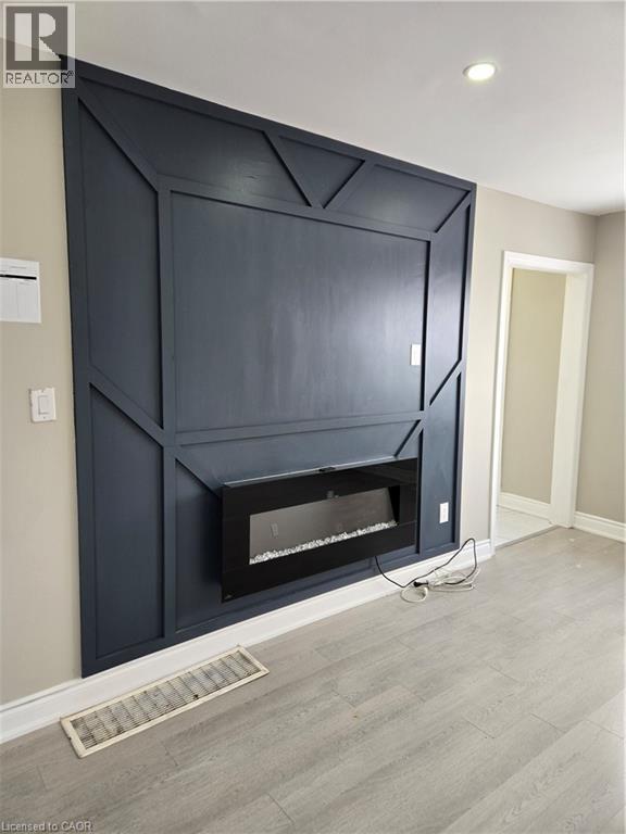 91 Barons Avenue S, Hamilton, ON - Indoor With Fireplace