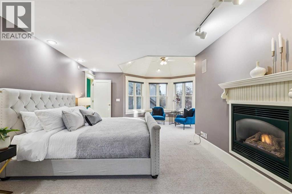 3019 6 Street Sw, Calgary, AB - Indoor Photo Showing Bedroom With Fireplace