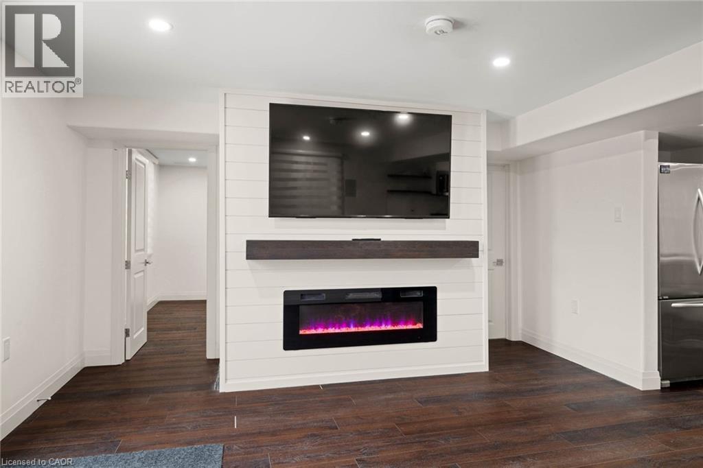 695 Robert Ferrie Drive Unit# Lower, Kitchener, ON - Indoor Photo Showing Living Room With Fireplace