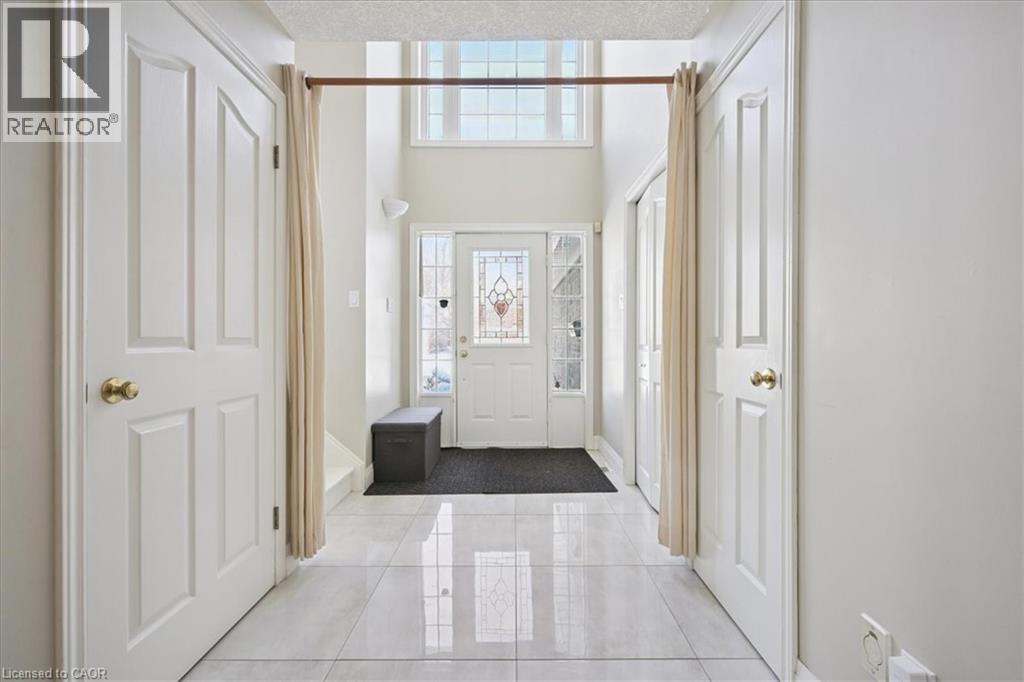 Entryway featuring light tile patterned flooring - 629 Burning Bush Road, Waterloo, ON - Indoor Photo Showing Other Room