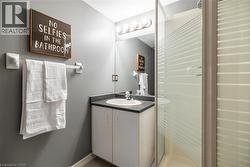 Full bath featuring vanity and a shower stall -