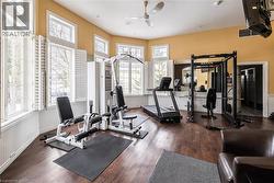 Exercise room with a heating unit and ceiling fan -