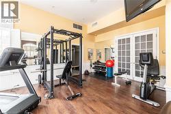Exercise room featuring wainscoting -