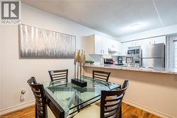 Dining area with light wood finished floors -