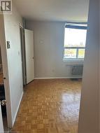 Spare room featuring light parquet floors -