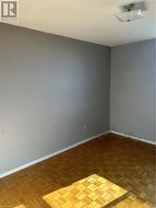 Spare room featuring parquet floors -