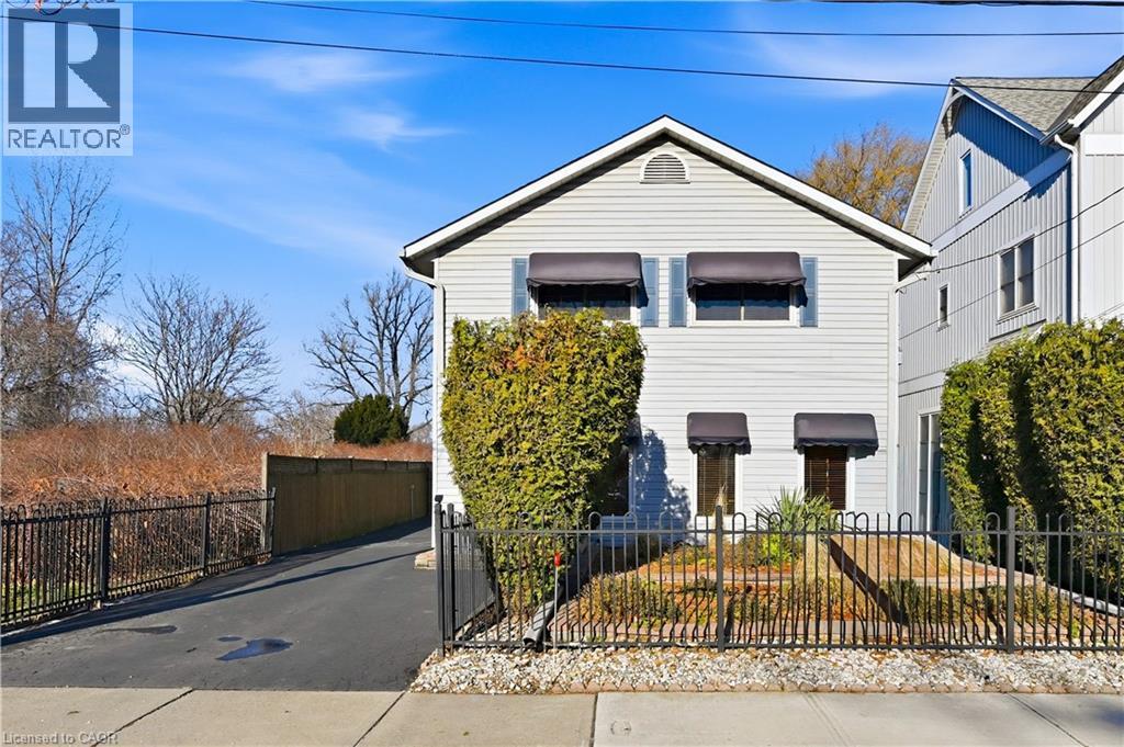 View of front of property featuring a fenced front yard - 21 Arden Avenue, Hamilton, ON - Outdoor