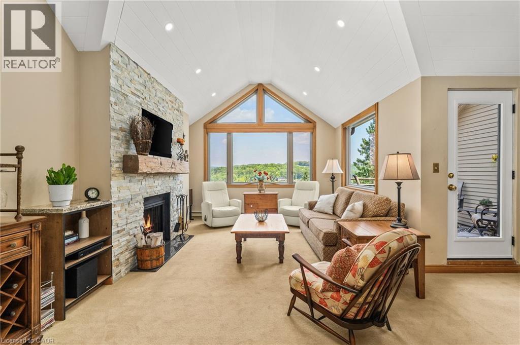 131 Grandview Hilltop Drive Unit# 1, Huntsville, ON - Indoor Photo Showing Living Room With Fireplace
