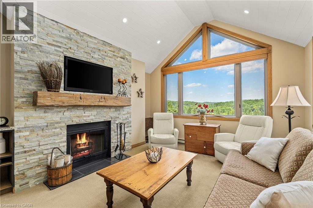 131 Grandview Hilltop Drive Unit# 1, Huntsville, ON - Indoor Photo Showing Living Room With Fireplace
