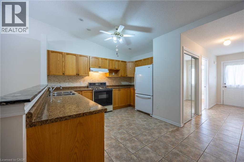 Another kitchen view with appliances included. - 510 Queensway W Unit# 5, Simcoe, ON - Indoor Photo Showing Kitchen With Double Sink