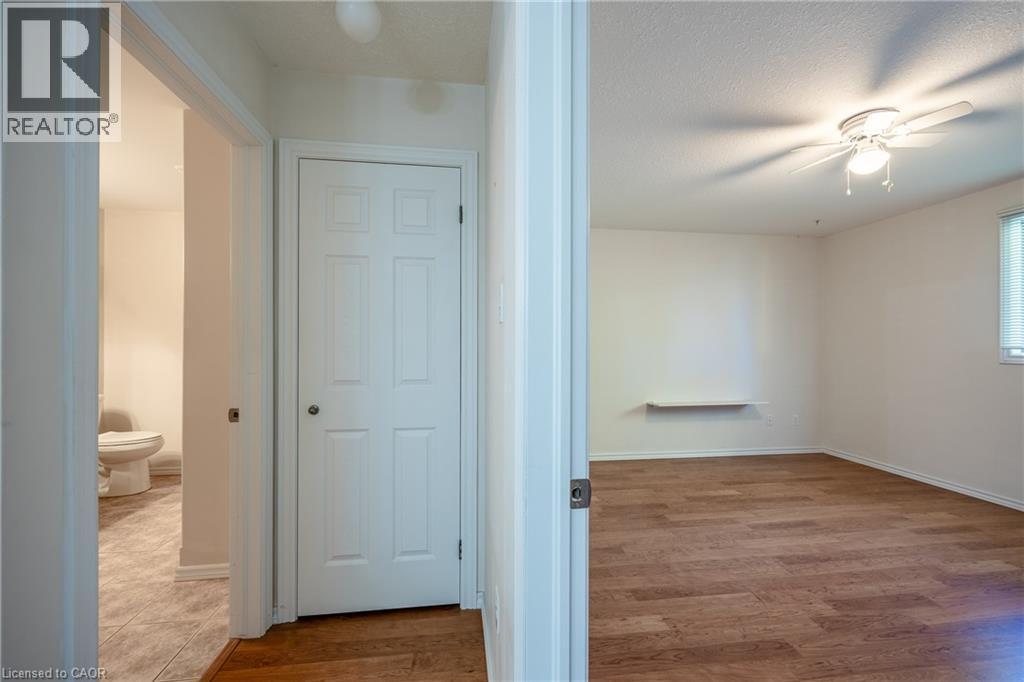 Primary bedroom and bathroom entry. Also a linrn closet. - 510 Queensway W Unit# 5, Simcoe, ON - Indoor Photo Showing Other Room