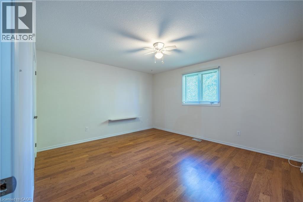 Primary bedroom with large west facing window. - 510 Queensway W Unit# 5, Simcoe, ON - Indoor Photo Showing Other Room