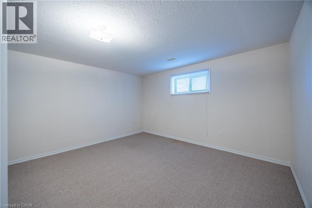 Lower level carpeted bedroom. - 510 Queensway W Unit# 5, Simcoe, ON - Indoor Photo Showing Other Room