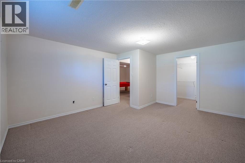 Large walk in storage closet in lower bedroom. - 510 Queensway W Unit# 5, Simcoe, ON - Indoor Photo Showing Other Room