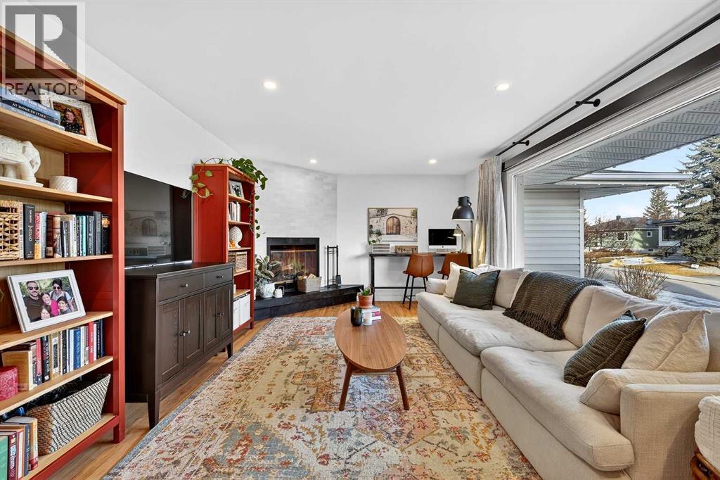 Living Room - 3231 25 Street Sw, Calgary, AB - Indoor Photo Showing Living Room With Fireplace