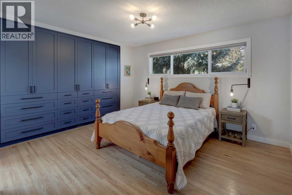 Primary suite with full wall of custom built in cabinetry - 36 Glenview Drive Sw, Calgary, AB - Indoor Photo Showing Bedroom