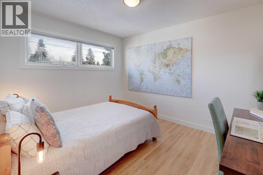 Second bedroom on the main level - 36 Glenview Drive Sw, Calgary, AB - Indoor Photo Showing Bedroom