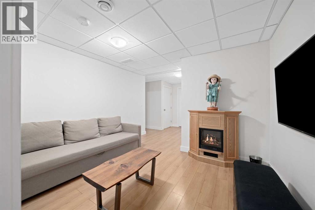 115 Mahogany Way Se, Calgary, AB - Indoor Photo Showing Living Room With Fireplace