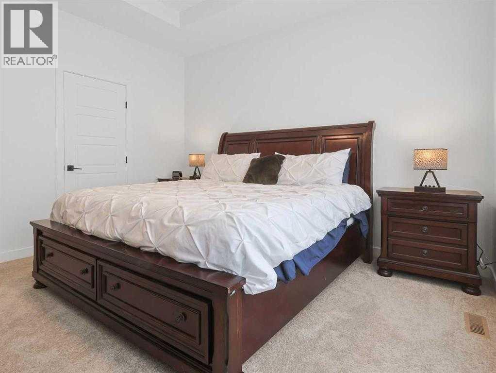 110 Sunstone Way, Balzac, AB - Indoor Photo Showing Bedroom