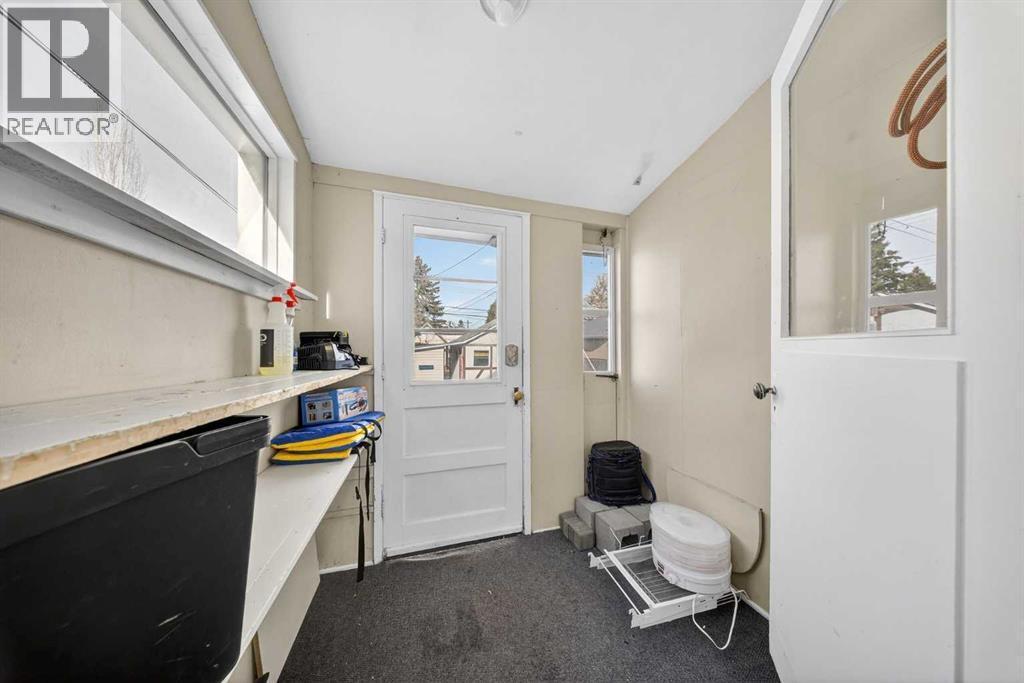 Mudroom leads to backyard and garage - 414 12 Avenue Nw, Calgary, AB - Indoor Photo Showing Other Room