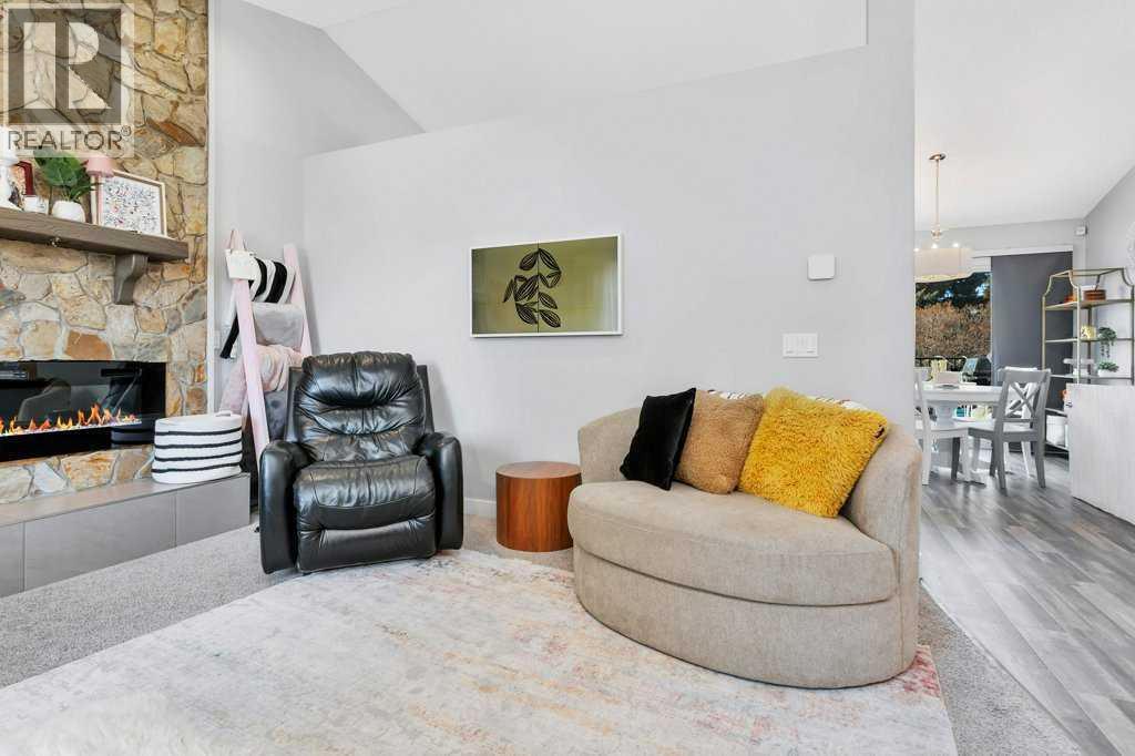 12 Rutherford Drive, Red Deer, AB - Indoor Photo Showing Other Room With Fireplace