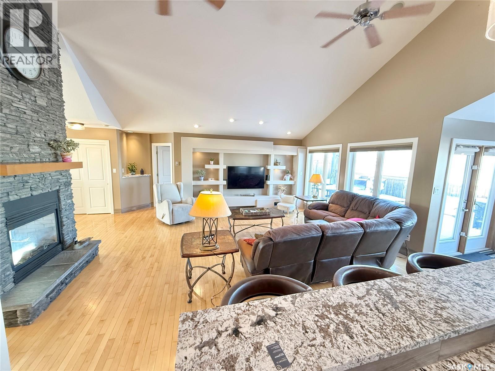 785 Washington Drive, Weyburn, SK - Indoor Photo Showing Living Room With Fireplace