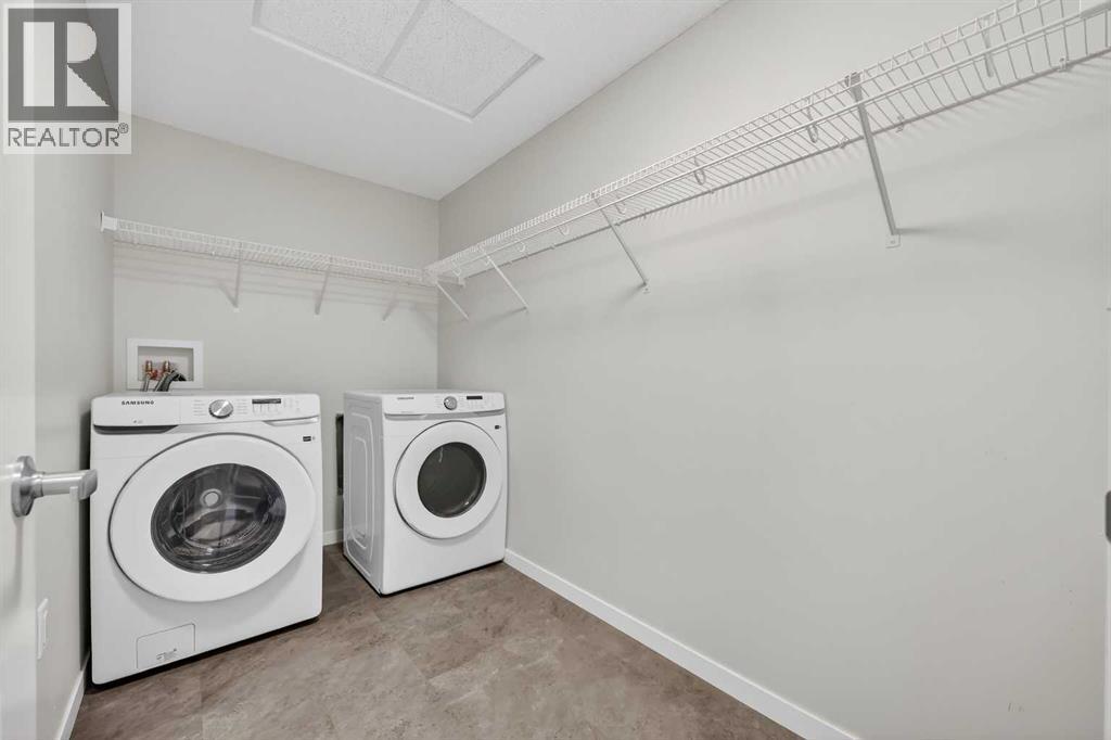 1410, 33 Carringham Gate Nw, Calgary, AB - Indoor Photo Showing Laundry Room