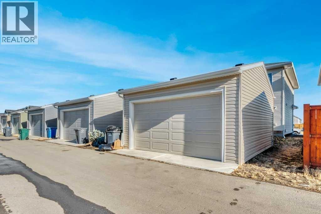 Double Detached Garage, Paved Alley - 121 Dawson Circle, Chestermere, AB - Outdoor