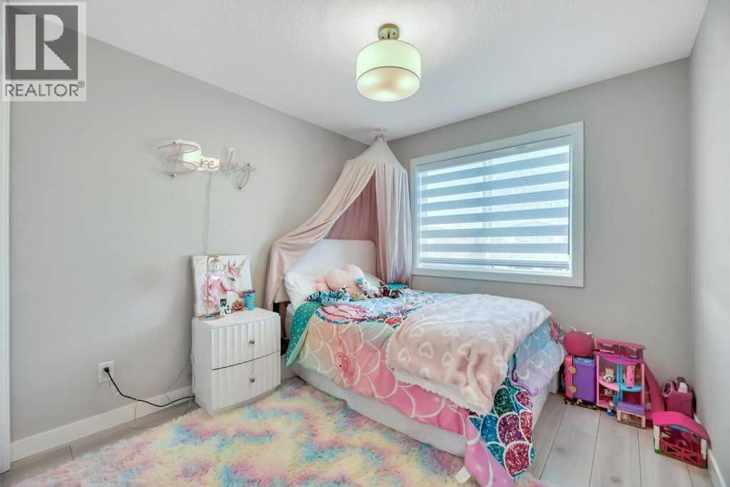 Bed #2 - 121 Dawson Circle, Chestermere, AB - Indoor Photo Showing Bedroom