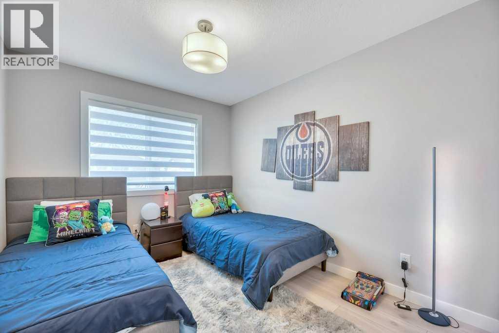 Bed #2 - 121 Dawson Circle, Chestermere, AB - Indoor Photo Showing Bedroom