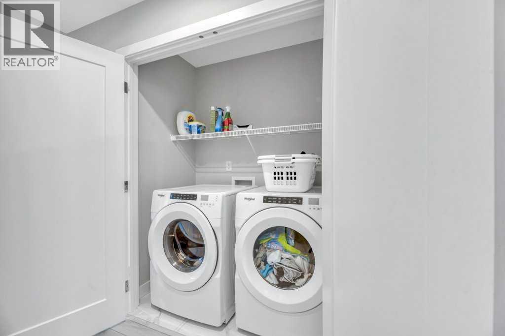 Upper Laundry - 121 Dawson Circle, Chestermere, AB - Indoor Photo Showing Laundry Room