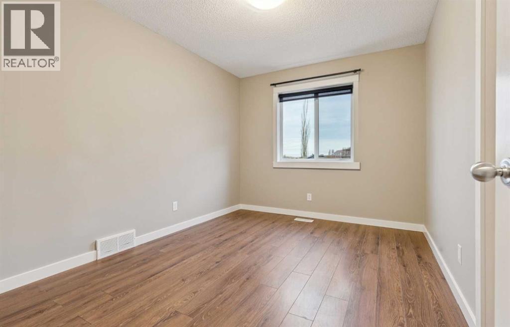 327 Panamount Point Nw, Calgary, AB - Indoor Photo Showing Other Room