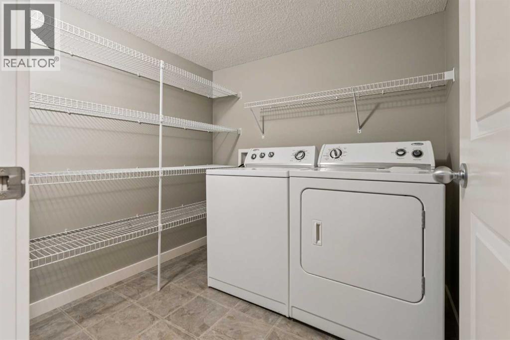 327 Panamount Point Nw, Calgary, AB - Indoor Photo Showing Laundry Room