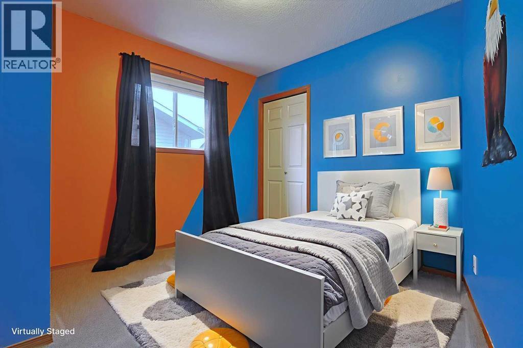 19 Sunridge Crescent Nw, Airdrie, AB - Indoor Photo Showing Bedroom