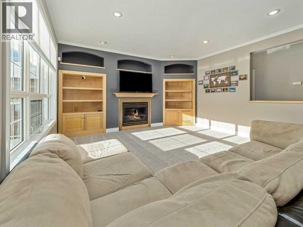 24 Fairmont Point S, Lethbridge, AB - Indoor Photo Showing Living Room With Fireplace