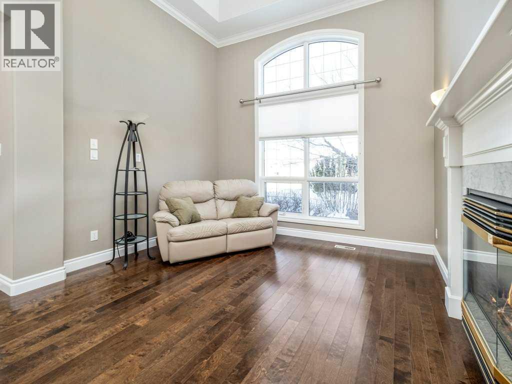 24 Fairmont Point S, Lethbridge, AB - Indoor Photo Showing Other Room With Fireplace