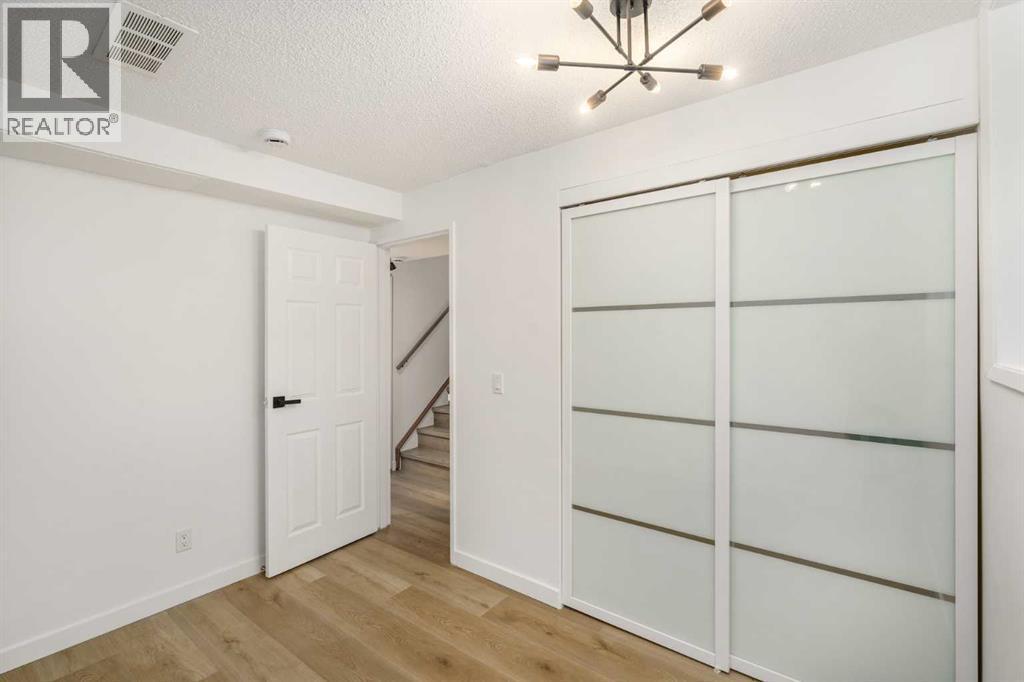 15 A Arlington Bay Se, Calgary, AB - Indoor Photo Showing Other Room