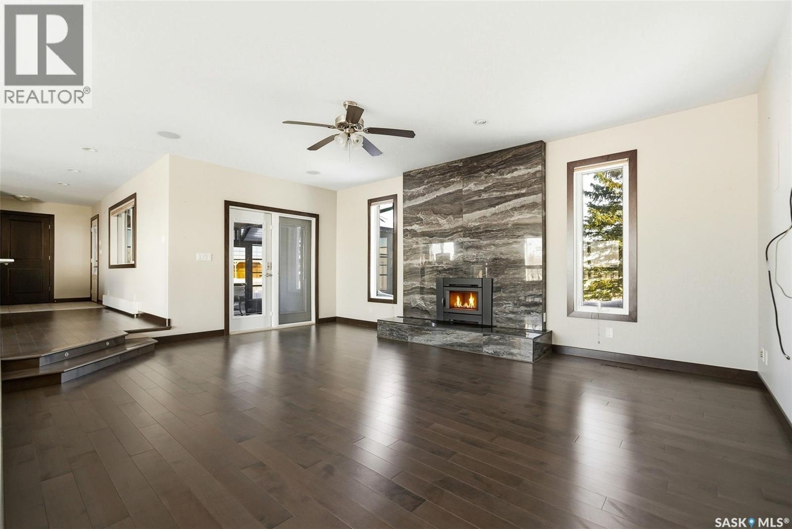Matt Acreage, Edenwold, SK - Indoor Photo Showing Living Room With Fireplace