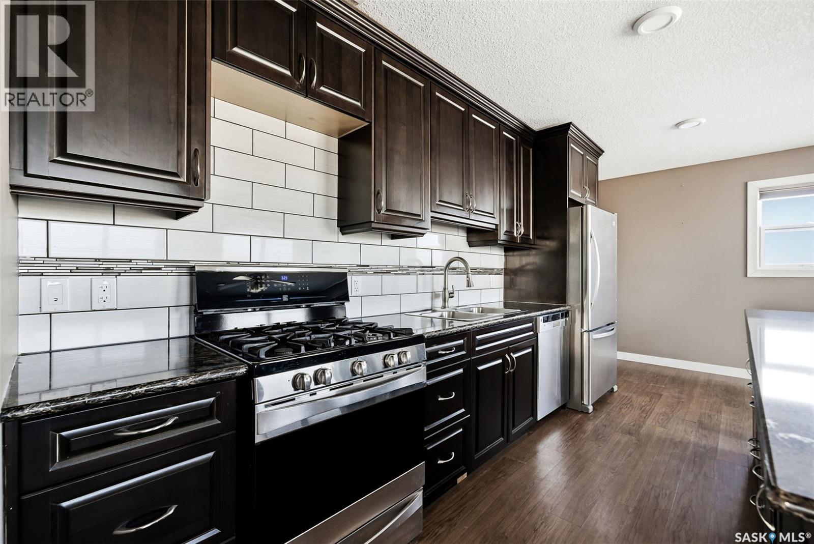 Matt Acreage, Edenwold, SK - Indoor Photo Showing Kitchen With Stainless Steel Kitchen