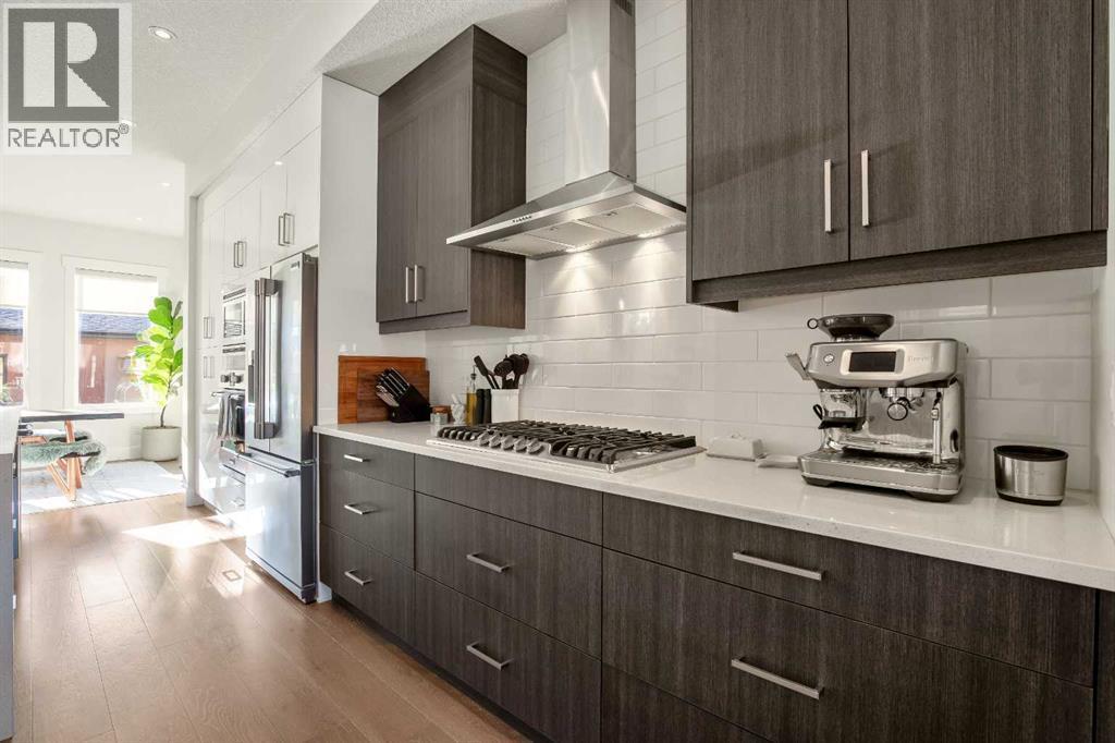 Built-in Gas Range Top - 303 30 Avenue Ne, Calgary, AB - Indoor Photo Showing Kitchen With Upgraded Kitchen