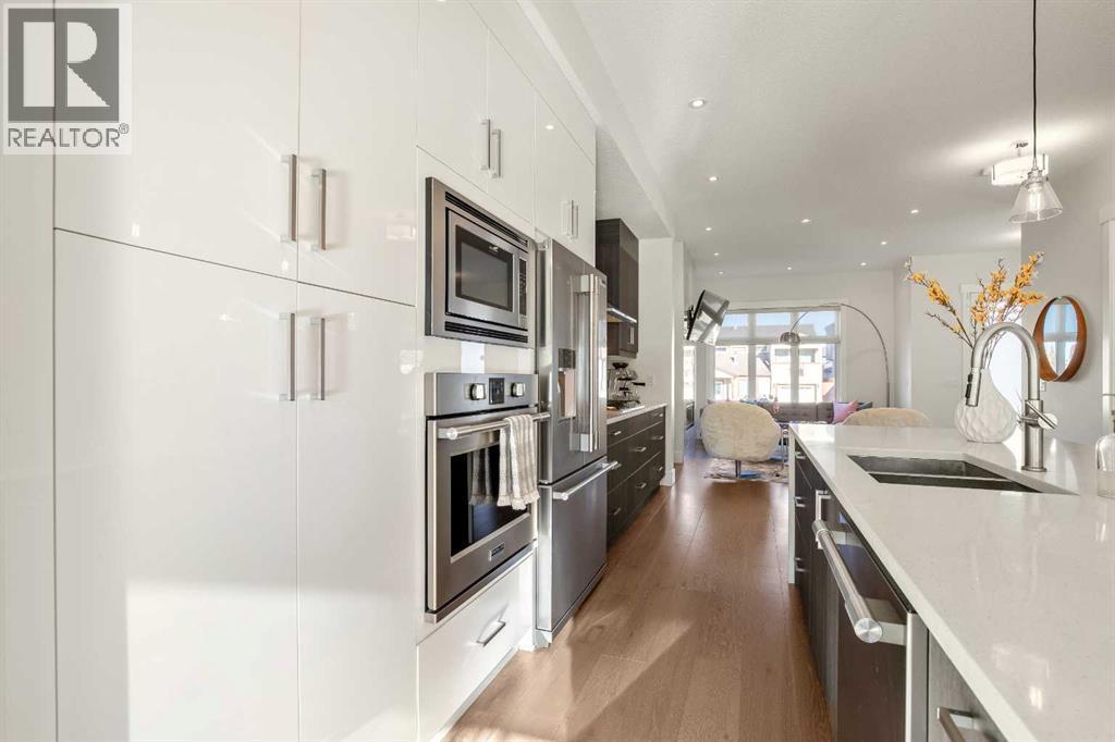 Lots of Cupboard & Storage Space + a Built-in Wall Oven & Microwave - 303 30 Avenue Ne, Calgary, AB - Indoor Photo Showing Kitchen With Double Sink With Upgraded Kitchen