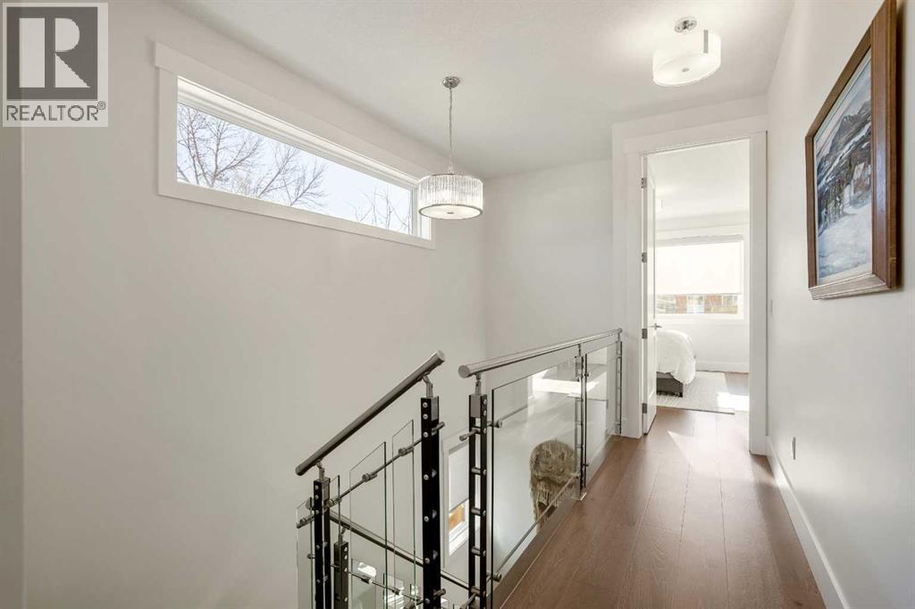 Upper Floor Hallway to Primary - 303 30 Avenue Ne, Calgary, AB - Indoor Photo Showing Other Room