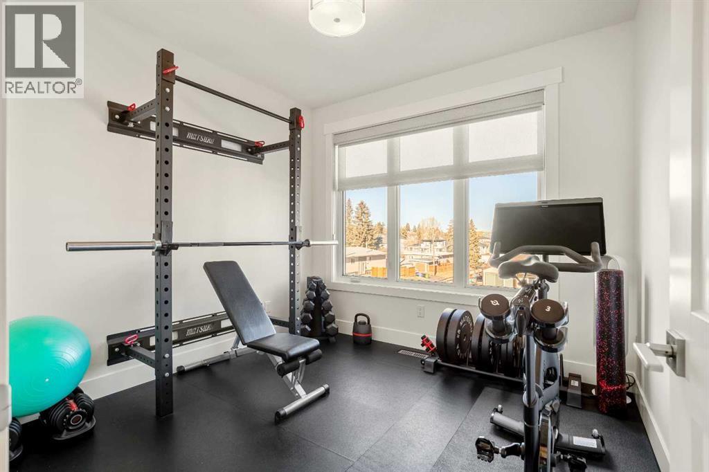 Bedroom #2- Upper Floor- Currently Being Utilized as a Gym - 303 30 Avenue Ne, Calgary, AB - Indoor Photo Showing Gym Room