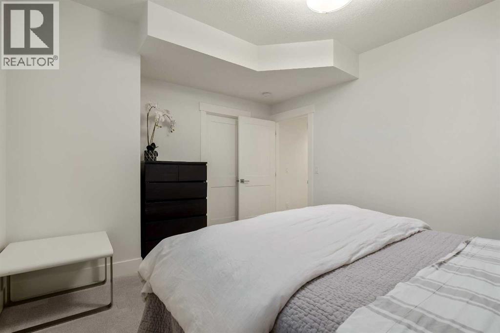 Large Walk-in Closet W/ Built-in Shelving - 303 30 Avenue Ne, Calgary, AB - Indoor Photo Showing Bedroom