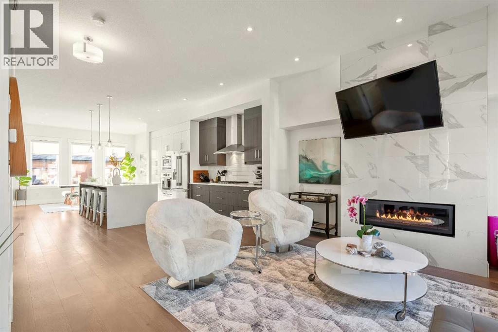 Open Floor plan W/ 10 Ft Ceilings! - 303 30 Avenue Ne, Calgary, AB - Indoor Photo Showing Living Room With Fireplace