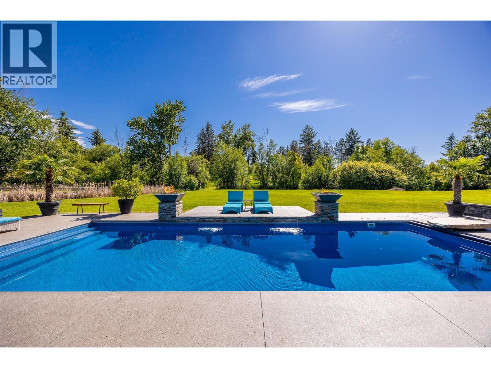 4284 Jaud Road, Kelowna, BC - Outdoor With In Ground Pool With Backyard