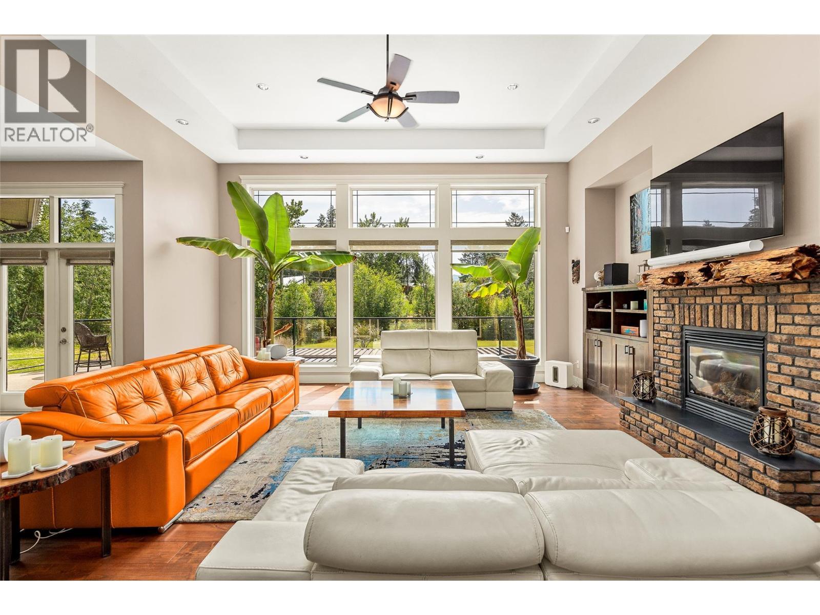 4284 Jaud Road, Kelowna, BC - Indoor Photo Showing Living Room With Fireplace
