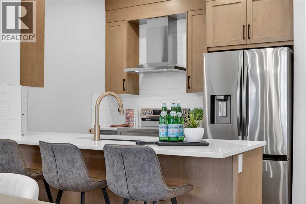 1051 Bayview Crescent, Airdrie, AB - Indoor Photo Showing Kitchen With Stainless Steel Kitchen With Upgraded Kitchen